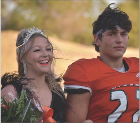 Morgan White and Pasquale Bitondi were crowned Homecoming royalty Friday night at the Liberty Bowl in Mangum. The Tigers defeated the Redskins by a whopping 62-6. See the complete story on page 11 of today’s edition.