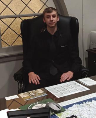 Could it be the future governor of the State of Oklahoma? Possibly. Nathan Kendall was sitting at the desk of Rep. Kendrix.