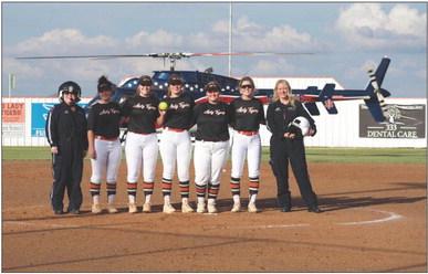 Air Evac flying in the game ball before the Mangum Lady Tiger softball game on Tuesday night!! There to meet them our 5 seniors Madyson Paxton, Morgan White, Messina Taylor, Hadley Zachary, and Landri Lively. Thank you to Air Evac and Greer County EMS. Courtesy photo
