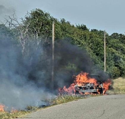 Vehicle fire threatens shelter