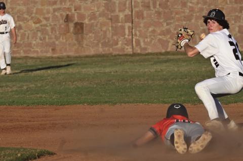 Second baseman Gavin Esparza, a sophomore, takes out one Merritt runner at second but could not get the double play.