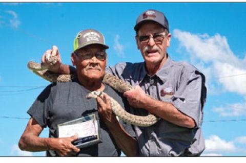Each year the Shortgrass Rattlesnake Association presents an award to the person who brings in the longest snake during the Mangum Rattlesnake Derby. This year, Melvin Ischcomber took the prize with this 81” rattler. PHOTO BY DIANA KENDALL